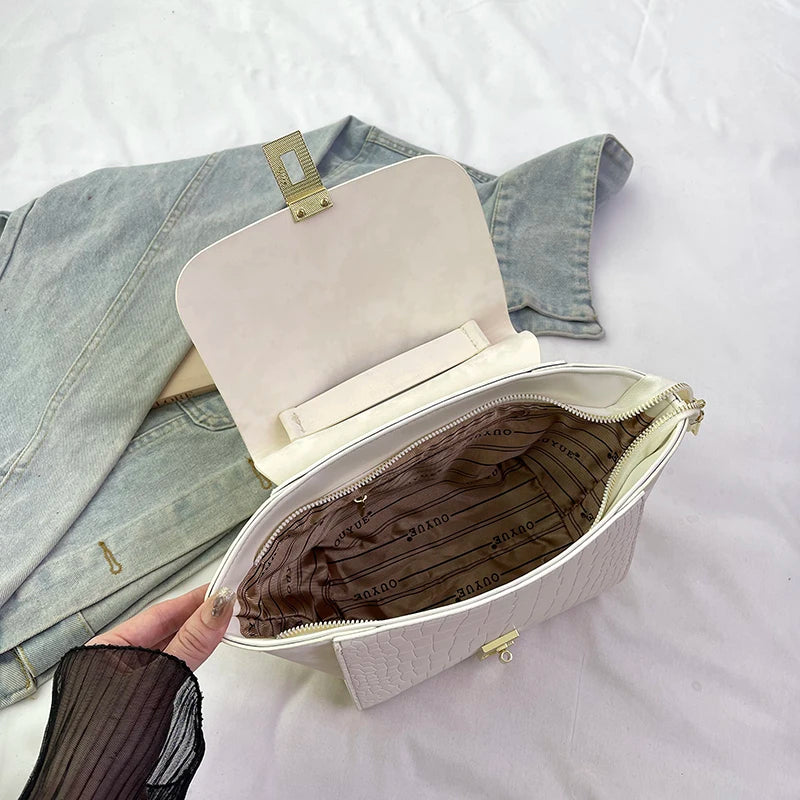 Modische Damenhandtasche in Flügelform (2026) mit drehbarem Verschluss – hochwertige Luxus-Umhängetasche im Krokodilleder-Look